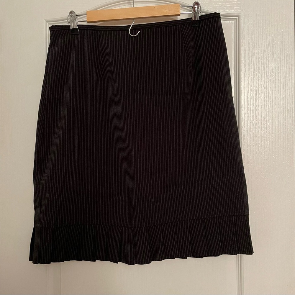 Black Pinstripe Mini Skirt with ruffle. Subtle sexy preppy and youthful look.